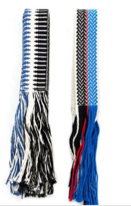 Blue woven belt with black and white zigzag pattern and fringed ends.