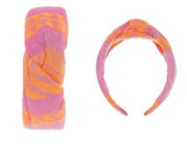 Wide fabric hairband with orange and pink tie-dye pattern and front knot detail.
