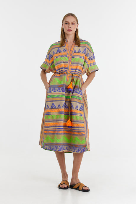 Mid-length jacquard dress with green, orange, and purple geometric patterns and short sleeves.