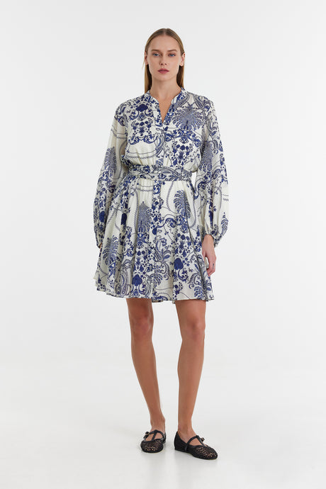 Blue and white printed short dress with long bishop sleeves and a tiered skirt.
