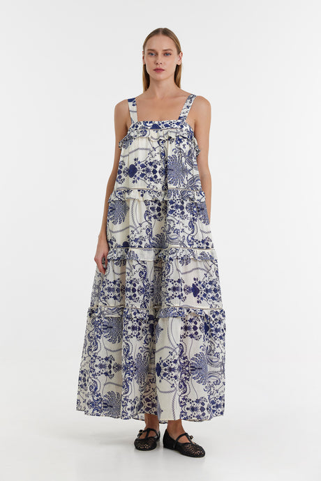 Sleeveless blue and white printed maxi dress with tiered skirt and square neckline.