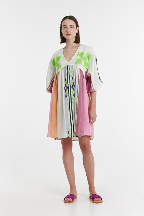 Short dress with pink, green, beige, and white color blocks, loose sleeves, and deep V-neck.