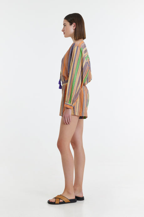 Side view of high-waist shorts with vertical green, orange, and purple jacquard stripes paired with matching loose.