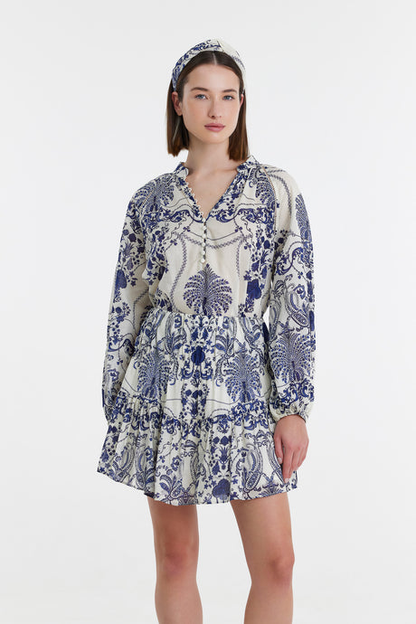 Blue and white floral print long-sleeve mini dress with ruffle hem and V-neck collar.