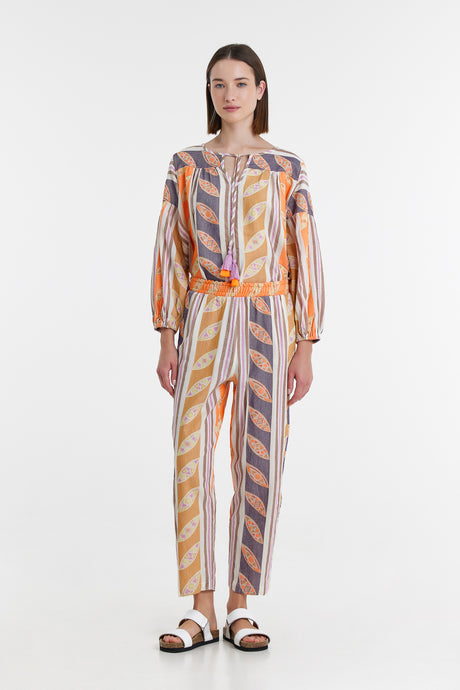 Orange and lilac striped long-sleeve button-up jumpsuit with cinched waist and relaxed fit.