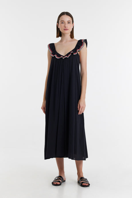 Black midi dress with ruffled shoulder straps and loose, flowing fit.