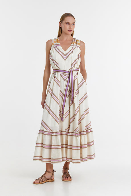 Sleeveless midi dress with lilac and beige striped pattern and matching waist tie, worn with brown sandals.