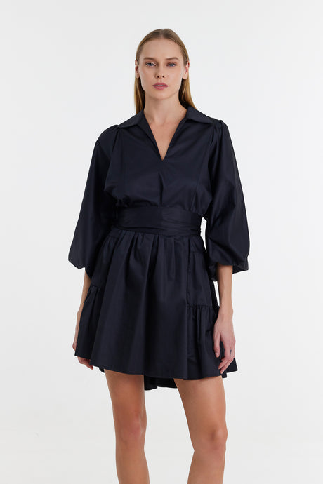 Black short dress with wide waistband, three-quarter puff sleeves, and collared V-neckline.