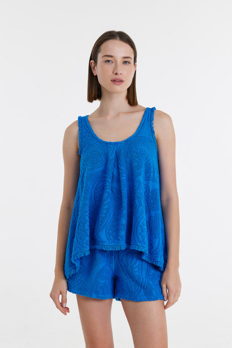 Blue sleeveless textured blouse with scoop neckline and relaxed fit.