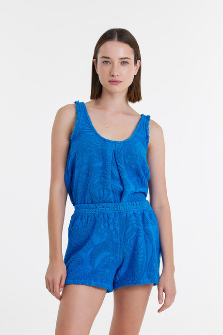 Blue sleeveless terry fabric tank top and matching elastic waist shorts set on model.
