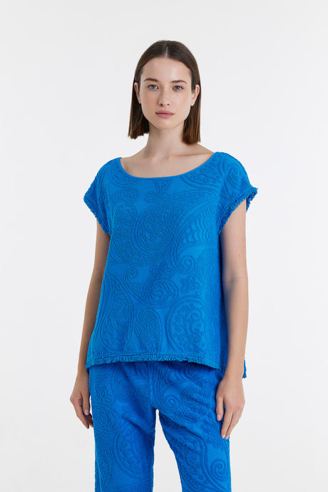 Bright blue short-sleeve blouse with subtle textured pattern, relaxed fit.