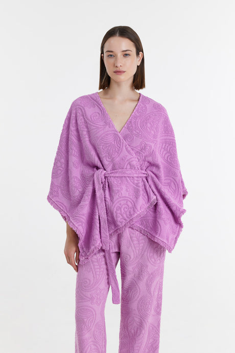 Lilac kimono blouse with wide sleeves and textured fabric, tied at the waist.
