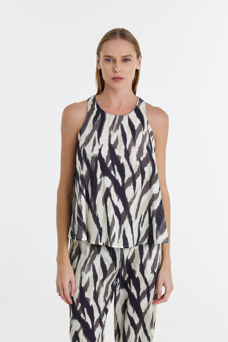 Black and white abstract print sleeveless blouse with a relaxed fit.