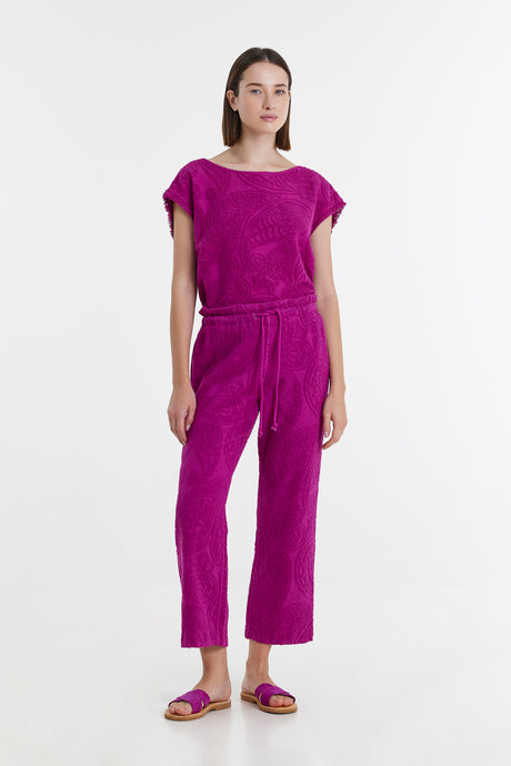 Magenta terry cloth short-sleeve top and matching drawstring pants set with relaxed fit.