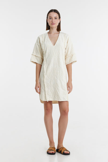 Off-white short dress with V-neck, wide sleeves, relaxed fit, and textured fabric.