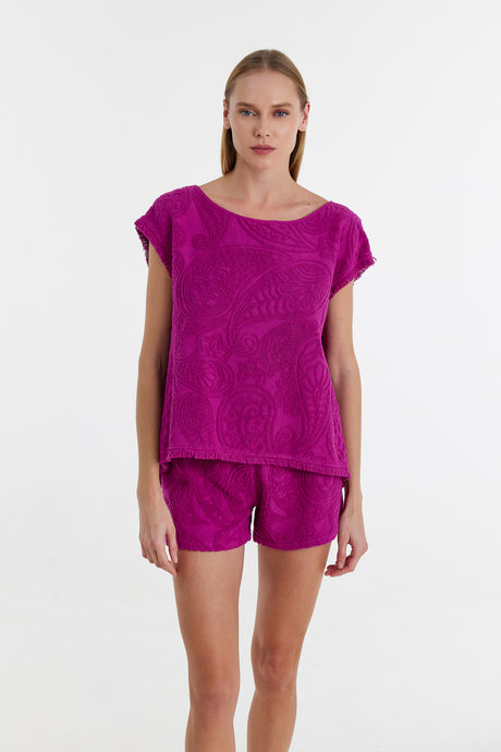 Magenta short-sleeve blouse with subtle floral pattern paired with matching shorts.