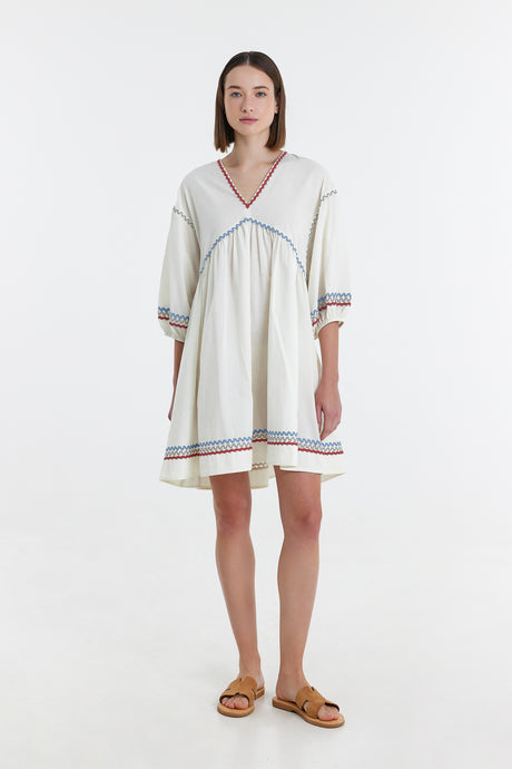 Off-white short dress with V-neck, blue and red trim, three-quarter sleeves, and relaxed fit.