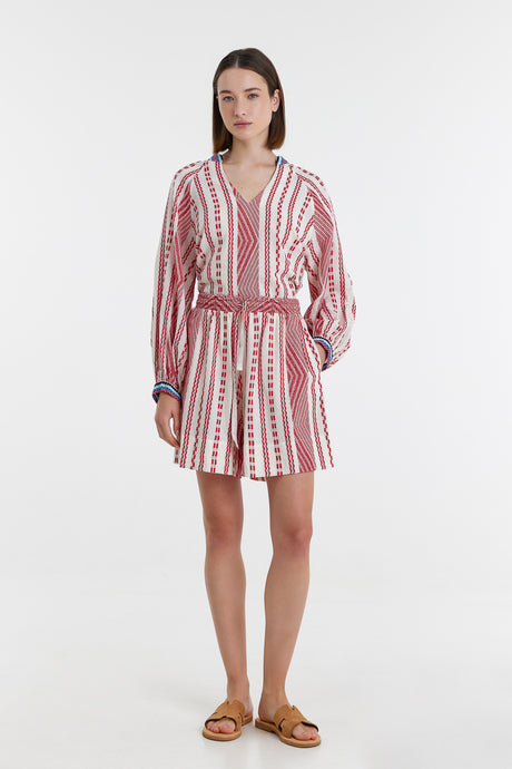 Red and off-white jacquard shorts with a matching long-sleeve top featuring vertical stripes and a deep V-neck.