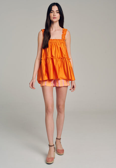 Bright orange sleeveless tiered popeline top with square neckline and loose fit.