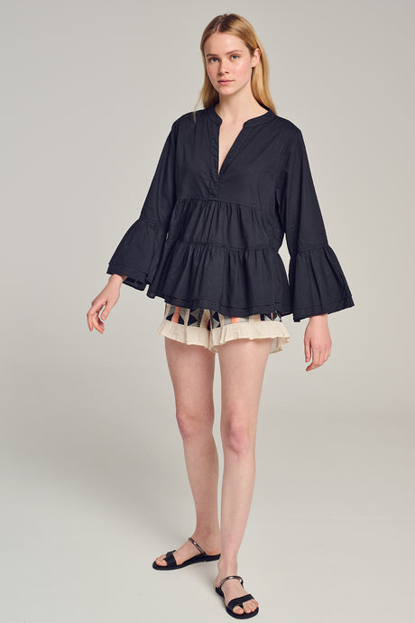 Black long-sleeve blouse with deep V-neck, gathered waist, and flared ruffle cuffs.