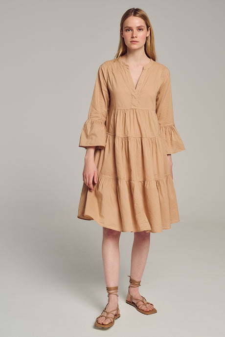 Beige midi dress with V-neck, tiered skirt, and flared three-quarter sleeves.