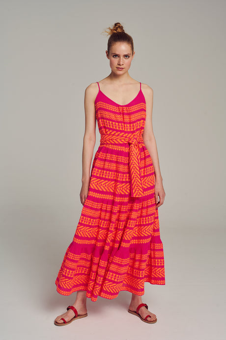 Sleeveless multi-color midi dress with pink and orange geometric jacquard pattern and tiered skirt.