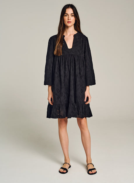 Black knee-length dress with long sleeves, subtle embroidery, and a relaxed V-neck silhouette.