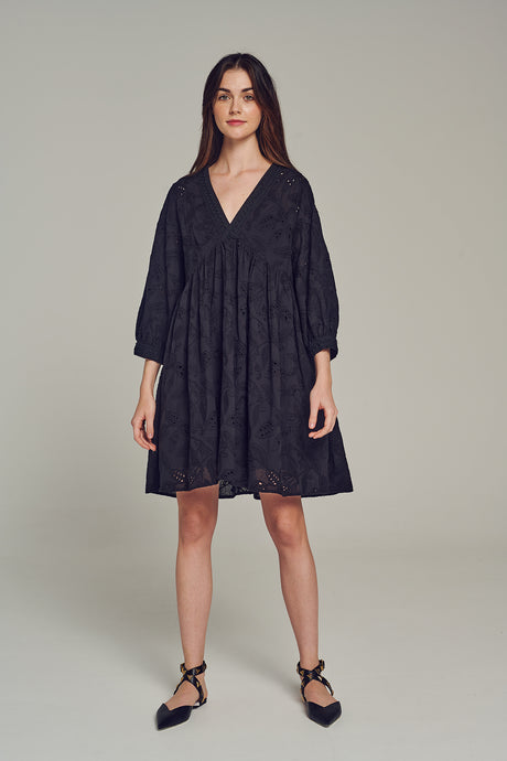 Black short dress with subtle embroidery, loose fit, V-neck, and long puffed sleeves.