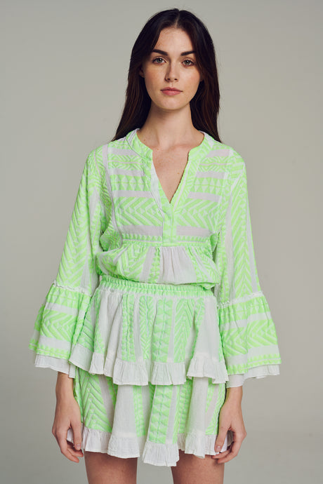 Green and white jacquard wrap skirt with ruffled hem in one size.