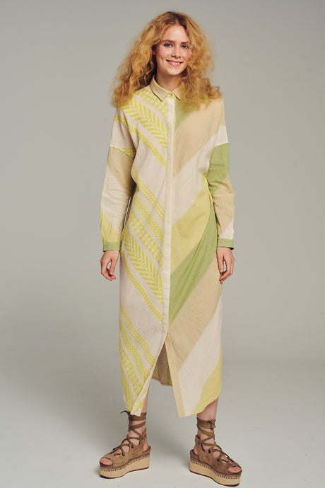 Long multicolor dress with geometric patterns, long sleeves, and a buttoned front neckline.