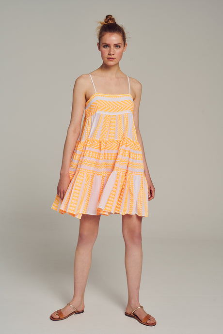 Orange and white jacquard sleeveless short dress with a flared skirt and spaghetti straps.