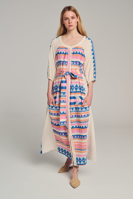 Midi jacquard dress with pink, blue, and cream geometric patterns, three-quarter sleeves, and front slit.