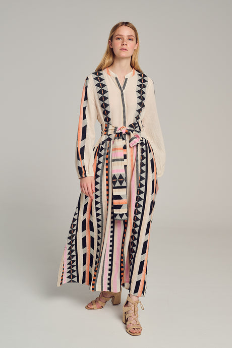 Long multi-color jacquard dress with vertical geometric patterns, belted waist, and long sleeves.