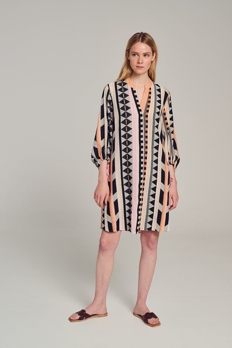 Knee-length dress with long balloon sleeves, V-neck, and vertical geometric stripes in black, beige, and soft pink.