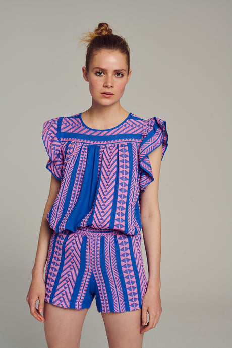 Multicolor jacquard shorts with pink and blue geometric patterns, high waist and relaxed fit.