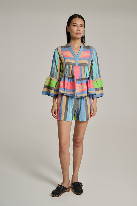 Long-sleeve tiered peplum top with colorful vertical stripes and puffed sleeves.