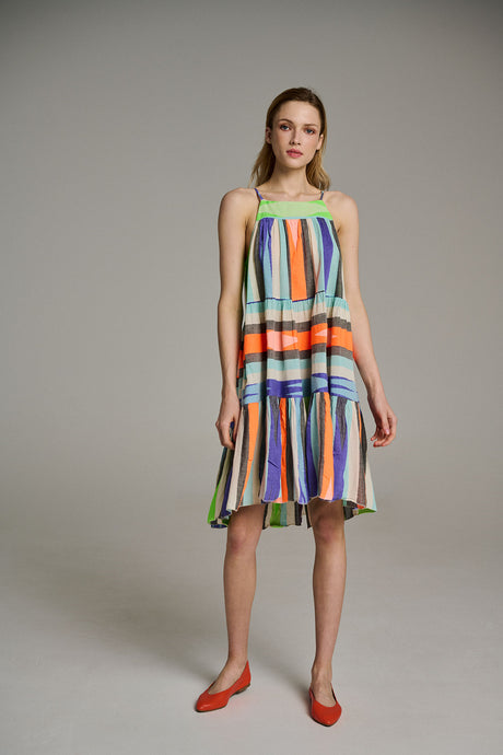 Sleeveless midi dress with multicolor vertical and horizontal stripes in blue, orange, green, and beige, paired with red.