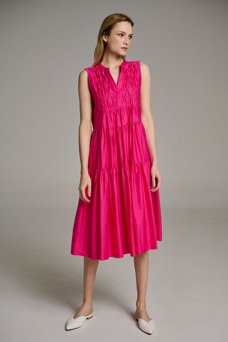 Sleeveless midi dress in bright pink popeline with a pleated bodice and flowy skirt.