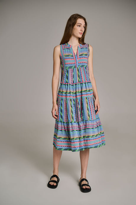 Sleeveless midi dress with blue and pink jacquard stripes and tiered skirt, worn with black sandals.