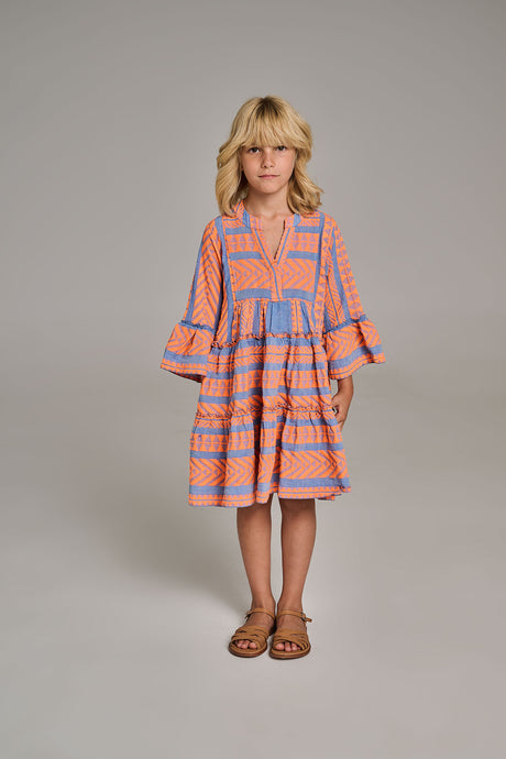 Orange and blue patterned tiered dress with ruffled sleeves on a child model.