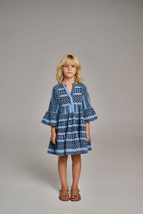 Black and blue patterned tiered dress with flared sleeves, worn by child model.