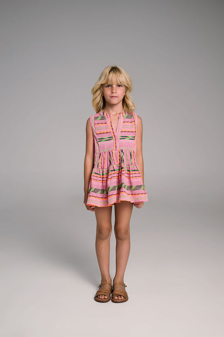 Sleeveless pink and orange striped dress with ruffled hem worn by young girl with blonde hair and sandals.