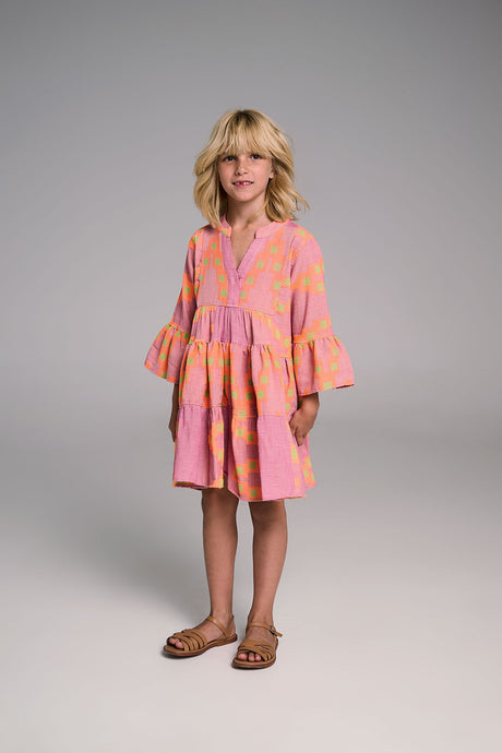 Pink and orange mini dress with bell sleeves and tiered skirt worn by child model.